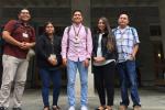 Five NYCALC junior faculty standing in front of a building