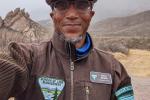BLM park ranger selfie in front of mountains