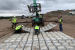 Las Cruces District Force Account crews layout and install articulating mats.