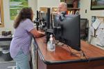 Two people talking inside a BLM Public Room. 