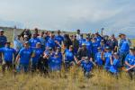 Volunteers pose for a photo wearing blue National Public Lands Day t-shirts