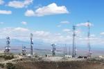 Communication towers on a hilltop right of way on public land