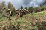 A crew of wildland firefighters, the Bonneville Interagency Hotshots, hiking while fighting the Thompson Ridge Fire.