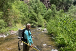 Malissa carries a backpack electrofisher