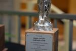 Closeup of trophy with a silver "Smokey Bear" figure on top.
