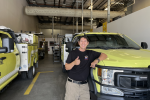 Luis Lopez in front of BLM fire vehicle