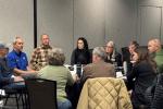BLM staff and local recreation partners discuss recreation in the Grand Junction area around a table at the Grand Junction Convention Center Jan. 13