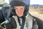 Closeup of Ranger Wostal in a helmet on an off-road vehicle