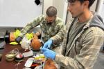 BLM firefighters participate in an airway management skill station at the National Advanced Fire and Rescue Resource institute in Tucson, Arizona. Photo by Dr. Drew, BLM. 
