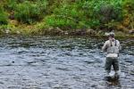 A man in the river, fly fishing on the Tangle River