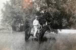Man on a horse in a black and white photo