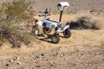 Rover navigating the Plaster City Open Area with a blue sky