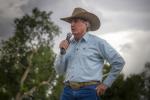 Secretary of the Interior Doug Burgum addresses the crowd on a cloudy day