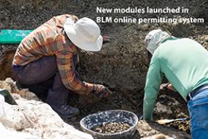 Two people digging in the dirt looking for fossils. Text: New modules launched in BLM online permitting system.