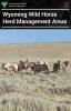 The cover of the HMA brochure featuring a small herd of wild horses in a sagebrush environment