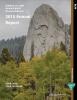 A rock formation shoots up behind a group of trees. Text reads, Bureau of Land Management Montana/Dakotas 2015 Annual Report