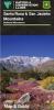 Thumbnail of brochure depicting purple and yellow wildflowers and tall mountains in the background.