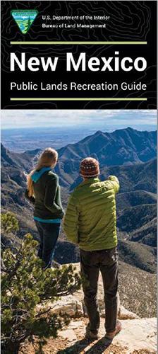 A couple standing on a bluff in New Mexico.